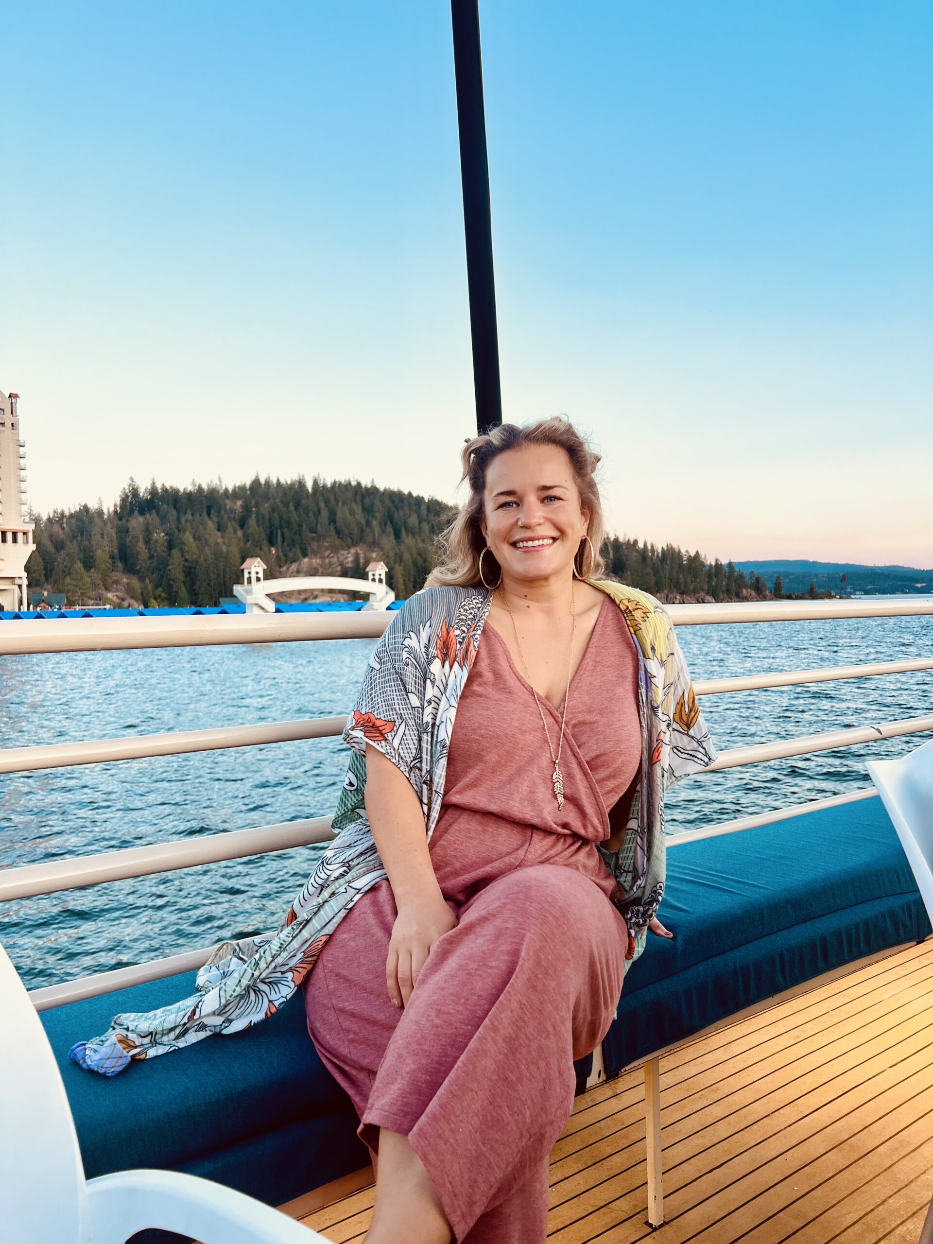 Woman sitting on boat on the lake